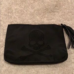 Black clutch purse with skull logo